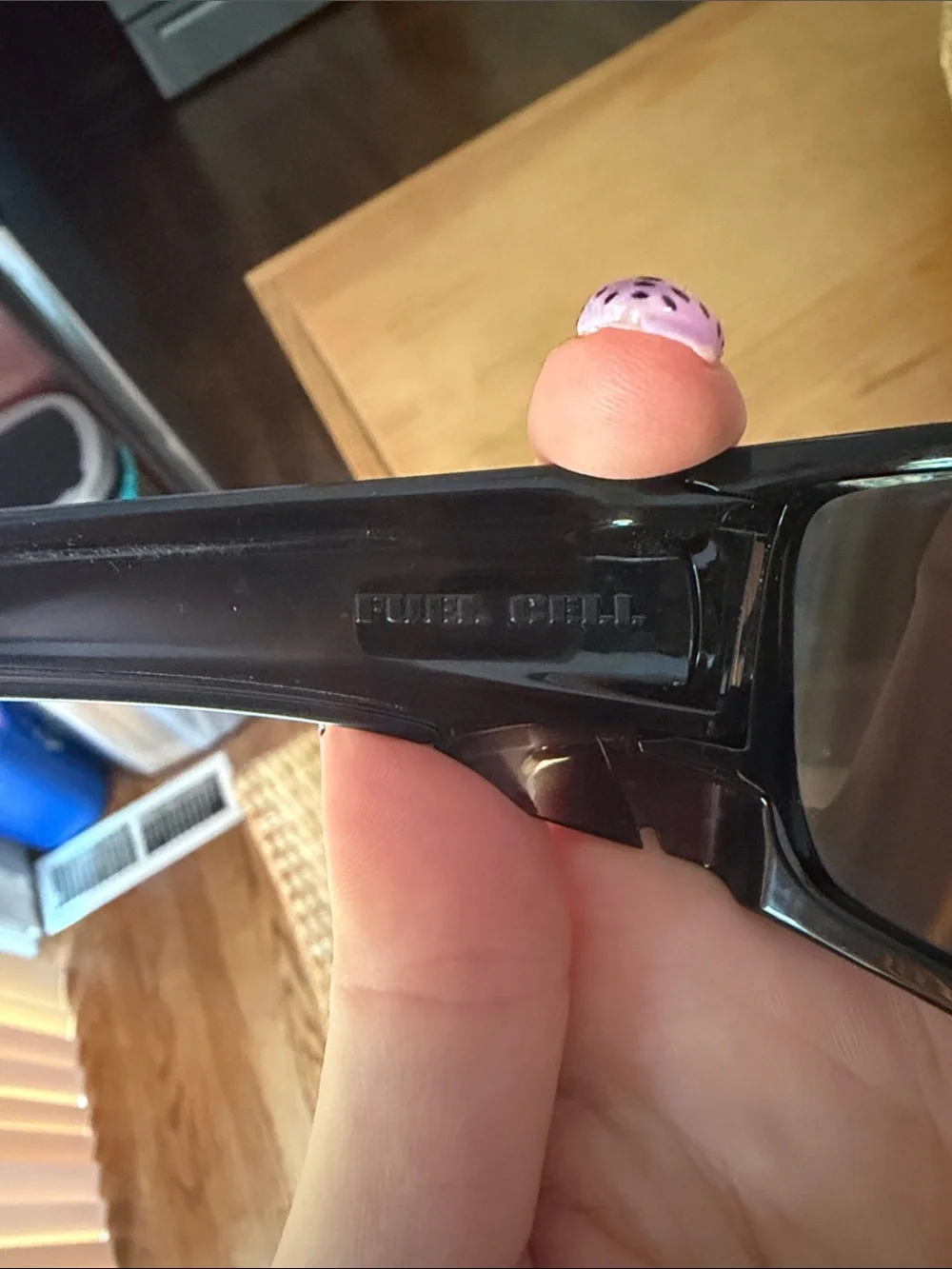 Oakley Black Frame Sunglasses with Blue Mirrored Lenses